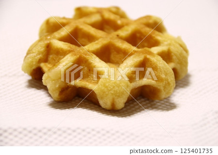 Delicious Belgian waffles Delicious Belgian waffles 125401735