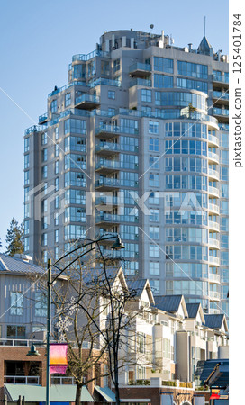 Residential high-rise and low-rise buildings on blue sky background 125401784