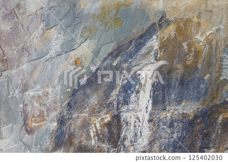 Close Up of Rough Stone Surface Featuring Multi Tone Earthy Color Patterns Close Up of Rough Stone Surface Featuring Multi Tone Earthy Color Patterns 125402030