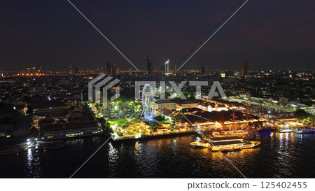 Skyscrapers and Ferris wheel in Bangkok city at night Skyscrapers and Ferris wheel in Bangkok city at night 125402455