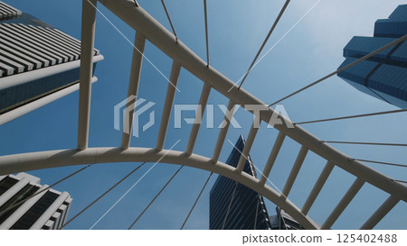 Walkway bridge arch and skyscrapers in Bangkok 125402488