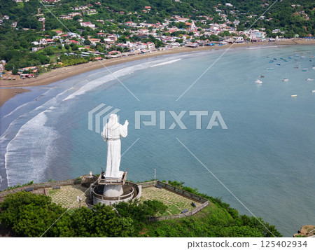 jesus christ staue monument on green hill 125402934
