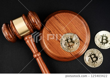 Judge gavel and gold bitcoins to the concept of judgement of cryptocurrencies. 125403422