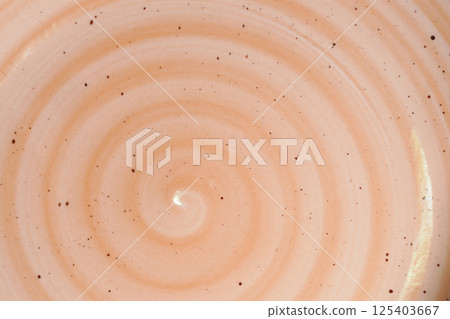 Orange pink spiral design ceramic detail close up Orange pink spiral design ceramic detail close up 125403667