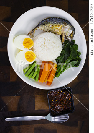 Steamed Rice With Fried Mackerel Chili Paste, Background for advertising and wallpaper in food and culture scene. 125403730