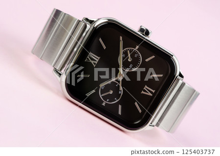 Product shot of a precious silver metal chronograph wrist watch with a black design placed. Product shot of a precious silver metal chronograph wrist watch with a black design placed. 125403737