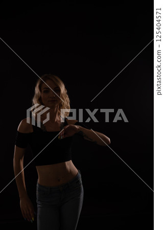 blonde woman dancing alone to music blonde woman dancing alone to music 125404571