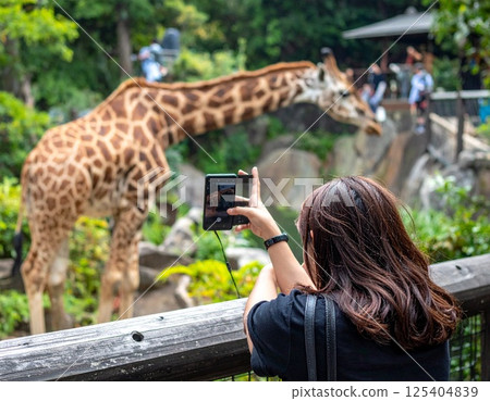 person taking photo with smartphone 125404839