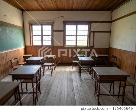 Abandoned wooden elementary school classroom, dusty desks, silence and nostalgia, natural light, Japanese countryside 125405649