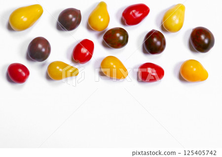 Assorted colorful cherry tomatoes crop on the white background. 125405742