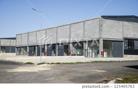 Empty Industrial warehouse building 125405761