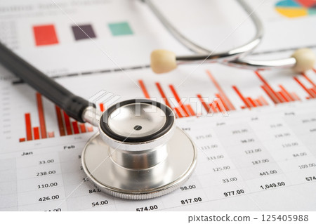 Stethoscope on spreadsheet and graph paper, Finance, Account, Statistics, Investment, Analytic research data economy and Business company. 125405988