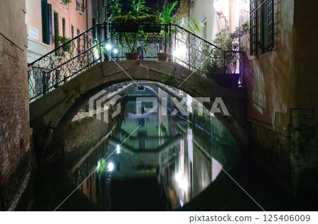 Romantic Venetian Bridge Over a Quiet Canal 125406009