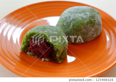 Mugwort Daifuku on the table background Mugwort Daifuku on the table background 125406328