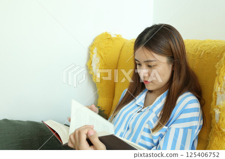 Reading Book at Home 125406752