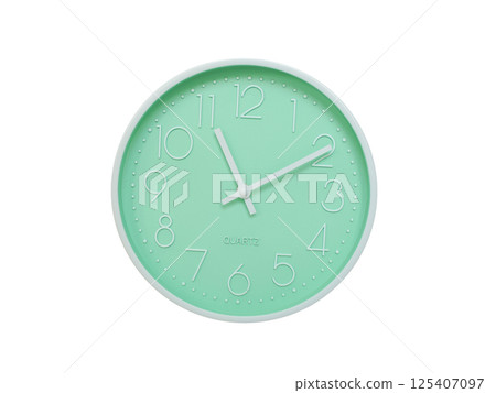 Modern mint green wall clock with white frame and numbers, showing 11:10 or 23:10. Ideal for minimalist designs, time-related content, or morning routine visuals. 125407097