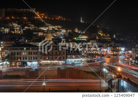 Tbilisi, Georgia - 23 November, 2025: Beautiful night view of Metekhi bridge and Old Tbilisi from the hill Tbilisi, Georgia - 23 November, 2025: Beautiful night view of Metekhi bridge and Old Tbilisi from the hill 125409047