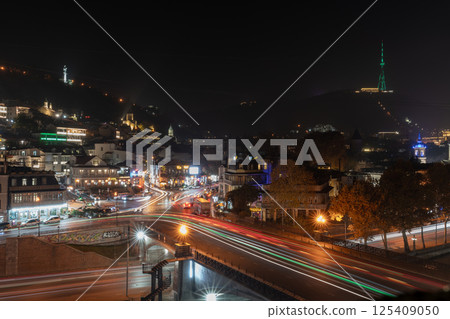 Tbilisi, Georgia - 23 November, 2025: Beautiful night view of Metekhi bridge and Old Tbilisi from the hill 125409050