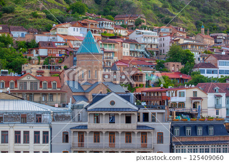 Traditional carved balconies and colorful wooden houses in the Old Town of Tbilisi 125409060
