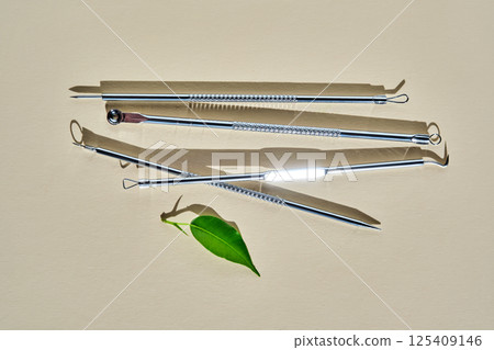 Tools for mechanical facial cleansing at home or at a cosmetologist on a beige background. Tools for mechanical facial cleansing at home or at a cosmetologist on a beige background. 125409146