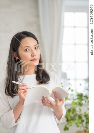 Studying woman | Diary | Hobby | Healthy lifestyle image | Well-being girl | Well-being Studying woman | Diary | Hobby | Healthy lifestyle image | Well-being girl | Well-being 125409246