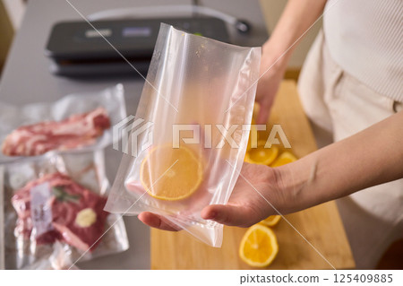 Efficiently Vacuum Sealing Fresh Citrus Fruits for Maximum Storage Time and Flavor Preservation Efficiently Vacuum Sealing Fresh Citrus Fruits for Maximum Storage Time and Flavor Preservation 125409885