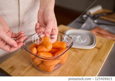 Preparing Healthy Meals Focus on Carrots and the Benefits of Vacuum Sealing Techniques Preparing Healthy Meals Focus on Carrots and the Benefits of Vacuum Sealing Techniques 125409923