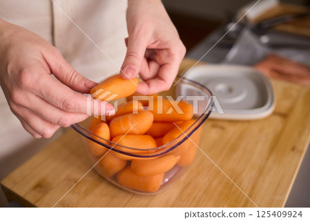 Preparing Healthy Meals Focus on Carrots and the Benefits of Vacuum Sealing Techniques Preparing Healthy Meals Focus on Carrots and the Benefits of Vacuum Sealing Techniques 125409924