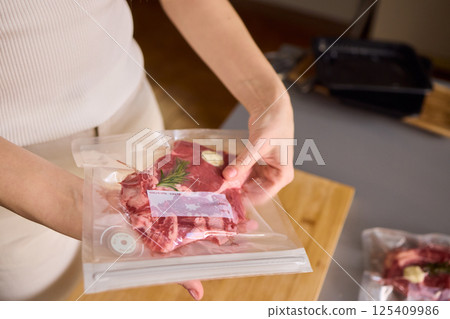 Sealing Fresh Meat for Preservation Using a Vacuum Sealer for Longer Lasting Freshness Sealing Fresh Meat for Preservation Using a Vacuum Sealer for Longer Lasting Freshness 125409986