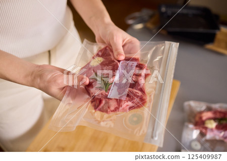 Sealing Fresh Meat for Preservation Using a Vacuum Sealer for Longer Lasting Freshness Sealing Fresh Meat for Preservation Using a Vacuum Sealer for Longer Lasting Freshness 125409987