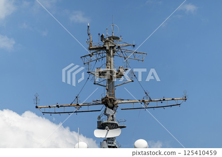 The mast of a large yacht with navigation equipment bottom view 125410459
