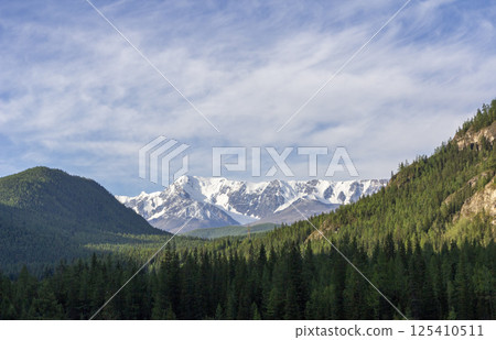Beautiful winter landscape with snow covered mountain peaks Beautiful winter landscape with snow covered mountain peaks 125410511