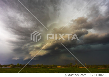 Dramatic storm clouds in the sky, dark severe storm clouds, supercell. Dramatic storm clouds in the sky, dark severe storm clouds, supercell. 125410659