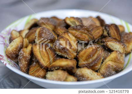 Curd cookies envelopes, homemade baked goods with crispy crust 125410770
