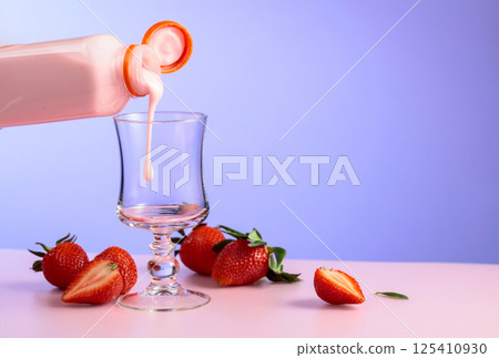 Strawberry milkshake smoothie and fresh berries on a colorful background. Strawberry milkshake smoothie and fresh berries on a colorful background. 125410930