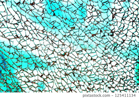 Broken tempered glass. Glass web of cracks. Changed color scheme. Colorful background. 125411134