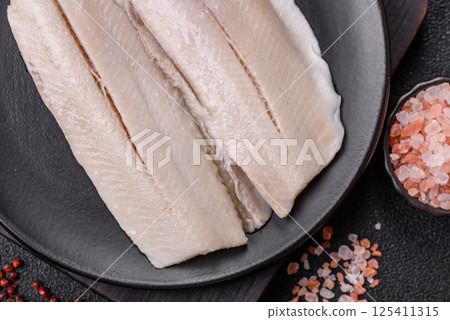Herring fillet salted and marinated with salt, spices and oil Herring fillet salted and marinated with salt, spices and oil 125411315