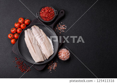 Herring fillet salted and marinated with salt, spices and oil 125411318