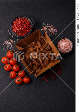 Crispy homemade brown bread crackers or croutons with seeds and grains 125411357