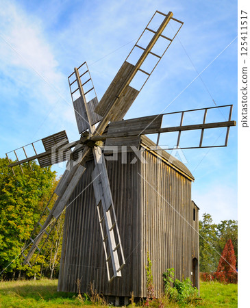 Old windmill in the Museum of National Architecture in Pirogovo, Kyiv, Ukraine. Old windmill in the Museum of National Architecture in Pirogovo, Kyiv, Ukraine. 125411517