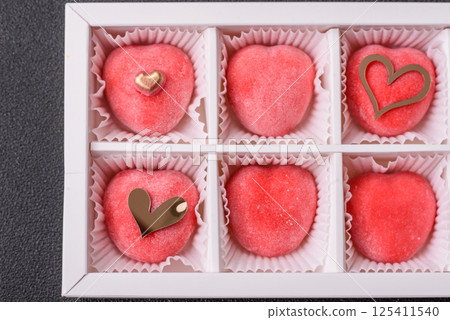 Delicious sweet mochi in the shape of red hearts Delicious sweet mochi in the shape of red hearts 125411540