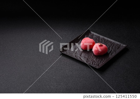 Delicious sweet mochi in the shape of red hearts 125411550
