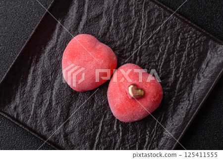 Delicious sweet mochi in the shape of red hearts Delicious sweet mochi in the shape of red hearts 125411555