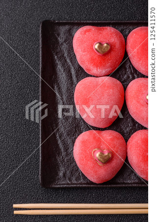 Delicious sweet mochi in the shape of red hearts 125411570