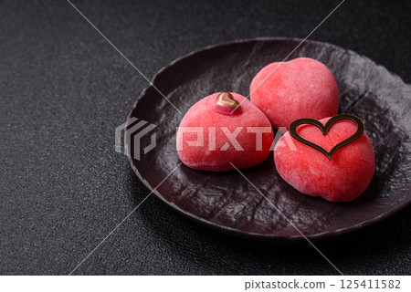 Delicious sweet mochi in the shape of red hearts 125411582