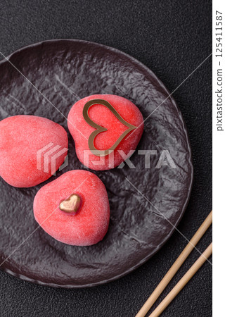 Delicious sweet mochi in the shape of red hearts 125411587