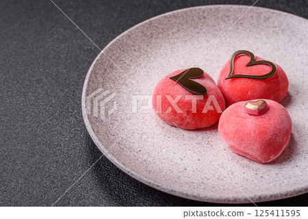 Delicious sweet mochi in the shape of red hearts 125411595