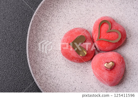 Delicious sweet mochi in the shape of red hearts 125411596