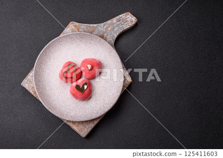 Delicious sweet mochi in the shape of red hearts 125411603