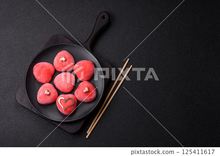 Delicious sweet mochi in the shape of red hearts Delicious sweet mochi in the shape of red hearts 125411617